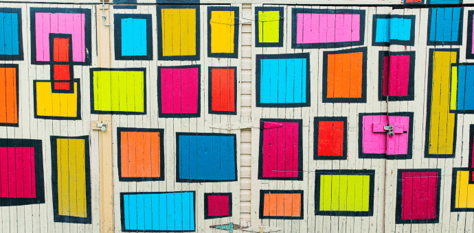 Photo of multi-coloured rectangles painted on big white doors